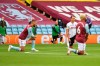 Players kneel prior to the start of the English Premier League soccer match between Aston Villa and Sheffield United at Villa Park in Birmingham, England, Wednesday, June 17, 2020. The English Premier League resumes Wednesday after its three-month suspension because of the coronavirus outbreak. (Paul Ellis/Pool via AP)