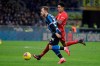 Inter Milan's Christian Eriksen , left, and Fiorentina's Erick Pulgar fight for the ball during an Italian Cup quarter finals soccer match between Inter Milan and Fiorentina at the San Siro stadium, in Milan, Italy, Wednesday, Jan. 29, 2020. (AP Photo/Luca Bruno)