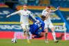 Chelsea's Reece James, center, challenges for the ball with Leeds United's Ezgjan Alioski, left and his teammate Leeds United's Mateusz Klich during the English Premier League soccer match between Leeds United and Chelsea at Elland Road stadium, in Leeds, England, Saturday, March 13, 2021. (Lindsey Parnaby/Pool via AP)