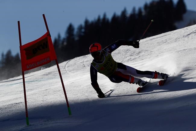 Spain's Albert Ortega speeds down the course during an alpine ski, men's World Cup giant slalom, in Adelboden, Switzerland, Friday, Jan.8, 2021. (AP Photo/Gabriele Facciotti)