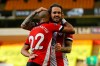 Southampton's Nathan Redmond, left, celebrates with his teammate Danny Ings scoring his side's third goal during the English Premier League soccer match between Norwich City and Southampton at Carrow Road in Norwich, England, Friday, June 19, 2020. (AP Photo/Richard Heathcote/Pool)