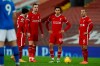 Liverpool players stand after Brighton's Steven Alzate scored his side's first goal during the English Premier League soccer match between Liverpool and Brighton at Anfield stadium, in Liverpool, England, Wednesday, Feb. 3, 2021. (Phil Noble/Pool via AP)