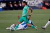 Real Madrid's Isco, is tackled by a Leganes' player during the Spanish La Liga soccer match between Leganes and Real Madrid at the Butarque Stadium in Leganes, on the outskirts of Madrid, Spain, Sunday, July 19, 2020. (AP Photo/Bernat Armangue)