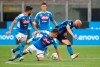 Napoli's Diego Demme, centre, tries to stop Inter Milan's Borja Valero, right, during the Serie A soccer match between Inter Milan and Napoli at the San Siro Stadium, in Milan, Italy, Tuesday, July 28, 2020. (AP Photo/Antonio Calanni)