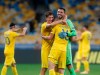 Ukraine's players celebrate their victory over Spaion following the UEFA Nations League soccer match between Ukraine and Spain at the Olimpiyskiy Stadium in Kyiv, Ukraine, Tuesday, Oct.13, 2020. Ukraine won the match 1-0. (AP Photo/Efrem Lukatsky)