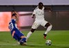 Real Madrid's Ferland Mendy, right, is blocked with penalty by Deportivo Alaves' Ximo Navarro, during the Spanish La Liga soccer match between Real Madrid and Deportivo Alaves at the Alfredo di Stefano stadium in Madrid, Spain, Friday, July 10, 2020. (AP Photo/Bernat Armangue)
