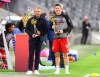 Bayern's Robert Lewandowski, right, poses with the trophy of the Footballer of the Year, along with Bayern coach Hansi Flick, that won the Coach of the Year award, prior to the German Bundesliga soccer match between FC Bayern Munich and Schalke 04 in Munich, Germany, Friday, Sept. 18, 2020. Bayern went on to win the match 8-0. (AP Photo/Matthias Schrader)
