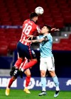 Atletico Madrid's Felipe, left, fights for the ball with Celta Vigo's Hugo Mallo during a La Liga soccer match between Atletico Madrid and Celta at the Wanda Metropolitano stadium in Madrid, Spain, Monday, Feb. 8, 2021. (AP Photo/Jose Breton)