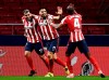 Atletico Madrid's Luis Suarez, center, celebrates with teammates after scoring during a La Liga soccer match between Atletico Madrid and Celta at the Wanda Metropolitano stadium in Madrid, Spain, Monday, Feb. 8, 2021. (AP Photo/Jose Breton)