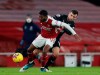 Crystal Palace's James McArthur, right, tries to stop Arsenal's Ainsley Maitland-Niles, left, during the English Premier League soccer match between Arsenal and Crystal Palace at Emirates Stadium in London, Thursday, Jan. 14, 2021. (AP Photo/Alastair Grant, Pool)