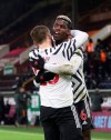 Manchester United's Paul Pogba celebrates after scoring during the English Premier League soccer match between Burnley and Manchester United in Burnley, England, Tuesday, Jan. 12, 2021. Manchester won the match 1-0.(Clive Brunskill/Pool via AP)