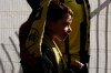 A child is wrapped in his father's Beitar Jerusalem FC soccer scarf during a team training session in Jerusalem, Friday, Dec. 11, 2020, days after the club announced that an Emirati sheikh has purchased a 50% stake in the team. Fans of the soccer club long associated with anti-Arab racism gathered Friday in a show of support for an Emirati businessman's purchase of a stake in the organization, welcoming it as a sign of change even as a smaller number of fans protested the move. (AP Photo/Maya Alleruzzo)