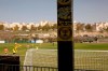 Beitar Jerusalem FC soccer fan stickers remain in an empty bleacher stand as the team practice in Jerusalem, Tuesday, Dec. 8, 2020, a day after the club announced that Emirati Sheikh Hamad bin Khalifa Al Nahyan, a member of the Abu Dhabi ruling family, has purchased a 50% stake in the team. (AP Photo/Maya Alleruzzo)