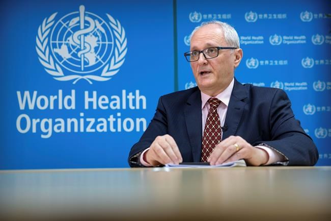 Dr. Gauden Galea, the World Health Organization (WHO) representative in China, speaks during an interview with The Associated Press at the WHO's offices in Beijing, Thursday, Jan. 23, 2020. Galea said that “trying to contain a city of 11 million people is new to science,” as Wuhan canceled departing trains and flights amid a viral outbreak that the representative said could infect thousands. (AP Photo/Mark Schiefelbein)