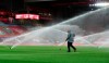 A groundsman works on the pitch ahead of the English League Cup fourth round soccer match between Liverpool and Arsenal at Anfield, Liverpool, England, Thursday, Oct. 1, 2020. (Peter Byrne/Pool via AP)