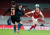 Arsenal's Sead Kolasinac, right, battles for the ball with Manchester City's Riyad Mahrez during the English League Cup quarterfinal soccer match between Arsenal and Manchester City at Emirates Stadium, London, Tuesday, Dec. 22, 2020. (AP Photo/Frank Augstein)