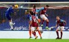 Chelsea's Thiago Silva, left, heads the ball to score his team's first goal during the English Premier League soccer match between Chelsea and West Ham at Stamford Bridge, London, Monday, Dec. 21, 2020. (AP Photo/Clive Rose,Pool)