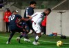 United States' Reggie Cannon, left, pulls at the shirt of Panama's Armando Cooper during the international friendly soccer match between the USA and Panama at the SC Wiener Neustadt stadium in Wiener Neustadt, Austria, Monday, Nov. 16, 2020. (AP Photo/Ronald Zak)