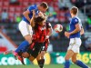 Leicester's Jonny Evans, left, heads the ball away from Bournemouth's Nathan Ake during the English Premier League soccer match between Bournemouth and Leicester City at Vitality Stadium in Bournemouth, England, Sunday, July 12, 2020. (AP Photo/Michael Steele,Pool)