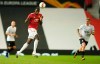 Manchester United's Paul Pogba heads the ball during the Europa League round of 16 second leg soccer match between Manchester United and LASK at Old Trafford in Manchester, England, Wednesday, Aug. 5, 2020. (AP Photo/Dave Thompson)