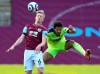 Burnley's Ben Mee, left, and Newcastle's Joelinton compete for the ball during the English Premier League soccer match between Burnley and Newcastle United at Turf Moor in Burnley, England, Sunday April 11, 2021. (AP Photo/Jon Super,Pool)