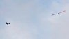 A plane towing a banner reading White Lives Matter Burnley flies above the stadium during the during the English Premier League soccer match between Manchester City and Burnley at Etihad Stadium, in Manchester, England, Monday, June 22, 2020. (AP Photo/Michael Regan,Pool)