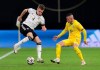 Germany's Matthias Ginter, left, and Ukraine's Oleksandr Subkow compete for the ball during the UEFA Nations League soccer match between Germany and the Ukraine at the Red Bull Arena in Leipzig, Germany, Saturday, Nov. 14, 2020. (AP Photo/Michael Sohn)