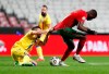 Andorras' Cristian Martinez, left, pulls at the shirt of Portugal's William Carvalho during the international friendly soccer match between Portugal and Andorra at the Luz stadium in Lisbon, Portugal, Wednesday, Nov. 11, 2020. (AP Photo/Armando Franca)