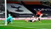 Manchester United's Anthony Martial, right, attempts a shot on goal during the English Premier League soccer match between Tottenham Hotspur and Manchester United at Tottenham Hotspur Stadium in London, England, Friday, June 19, 2020. (AP Photo/Glyn Kirk, Pool)