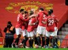 Manchester United players celebrate after their first goal during the English Premier League soccer match between Manchester United and West Ham United at Old Trafford, Manchester, England, Sunday, March. 14, 2021. (AP Photo/Peter Powell,Pool)
