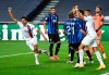 PSG's Marquinhos, left, celebrates after scoring his team's first goal during the Champions League quarterfinal match between Atalanta and PSG at Luz stadium, Lisbon, Portugal, Wednesday, Aug. 12, 2020. (David Ramos/Pool Photo via AP)