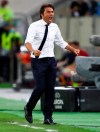 Inter Milan's head coach Antonio Conte reacts after his teams win in the Europa League quarterfinal match between Inter Milan and Bayer Leverkusen at the Duesseldorf Arena in Dusseldorf, Germany, Monday, Aug. 10, 2020. (Dean Mouhtaropoulos, Pool Photo via AP)