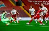 Liverpool's Andrew Robertson, second right, scores his teams second goal during the English Premier League soccer match between Liverpool and Arsenal at Anfield in Liverpool, England, Monday, Sept. 28, 2020. (Jason Cairnduff/Pool via AP)