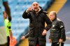 Manchester City's head coach Pep Guardiola gestures during the English Premier League soccer match between Manchester City and Leeds United at Etihad Stadium, Manchester, England, Saturday April 10, 2021. (AP Photo/Rui Vieira,Pool)