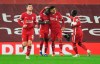 Liverpool's Sadio Mane, second lefties congratulated by teammates after scoring his team's first goal during the English Premier League soccer match between Liverpool and Arsenal at Anfield in Liverpool, England, Monday, Sept. 28, 2020. (Paul Ellis/Pool via AP)