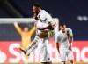 PSG's Neymar celebrates with teammate Eric Maxim Choupo-Moting after his team's win in the Champions League quarterfinal match between Atalanta and PSG at Luz stadium, Lisbon, Portugal, Wednesday, Aug. 12, 2020. (David Ramos/Pool Photo via AP)