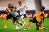 Manchester City's Kevin De Bruyne centre, takes the ball say from Wolverhampton Wanderers' Willy Boly, right, during the English Premier League soccer match between Wolverhampton Wanderers and Manchester City at Molineux Stadium in Wolverhampton, England, Monday, Sept. 21, 2020. (Marc Atkins/Pool via AP)
