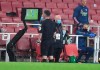 Referee Chris Kavangah looks at the VAR before giving Arsenal's Eddie Nketiah, not pictured, a red card during the English Premier League soccer match between Arsenal and Leicester at Emirates Stadium in London, England, Tuesday, July 7, 2020. (AP Photo/Michael Regan,Pool)