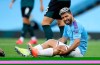 Manchester City's Sergio Aguero reacts as he sits on the pitch injured during the English Premier League soccer match between Manchester City and Burnley at Etihad Stadium, in Manchester, England, Monday, June 22, 2020. (AP Photo/Martin Rickett,Pool)