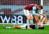 Aston Villa's Matt Targett, top, celebrates with teammate Trezeguet after the English Premier League soccer match between Aston Villa and Arsenal at Villa Park in Birmingham, England, Tuesday, July 21, 2020. (AP Photo/Peter Powell,Pool)