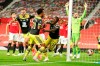 Southampton's Michael Obafemi, centre,celebrates after scoring his team's second goal during the English Premier League soccer match between Manchester United and Southampton at Old Trafford in Manchester, England, Monday, July 13, 2020. (AP Photo/Dave Thompson,Pool)