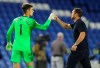 Chelsea's goalkeeper Kepa Arrizabalaga, left, is congratulated by Chelsea's head coach Frank Lampard after their English Premier League soccer win over Brighton at Falmer Stadium in Brighton, England, Monday, Sept. 14, 2020. (Glynn Kirk/Pool via AP)