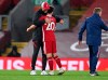 Liverpool's manager Jurgen Klopp, left, embraces Liverpool's Diogo Jota after their English Premier League soccer match between Liverpool and Arsenal at Anfield in Liverpool, England, Monday, Sept. 28, 2020. (Laurence Griffiths/Pool via AP)
