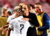PSG's head coach Thomas Tuchel, right, embraces Kylian Mbappe after their win in the Champions League quarterfinal match between Atalanta and PSG at Luz stadium, Lisbon, Portugal, Wednesday, Aug. 12, 2020. (David Ramos/Pool Photo via AP)