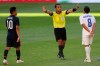 Honduras' Edwin Rodriguez, right, protests to referee Ivan Barton, of El Salvador, during a Concacaf Men's Olympic qualifying championship semi-final soccer match in Guadalajara, Mexico, Sunday, March 28, 2021. (AP Photo/Fernando Llano)