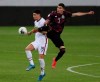 Mexico's Johan Vasquez (5) and United States' Sebastian Soto fight for the ball during a Concacaf Men's Olympic Qualifying championship soccer match in Guadalajara, Mexico, Wednesday, March 24, 2021. (AP Photo/Fernando Llano)