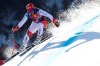 Switzerland's Beat Feuz speeds down the course during an alpine ski, men's World Cup downhill in Kitzbühel, Austria, Friday, Jan. 22, 2021. (AP Photo/Marco Trovati)