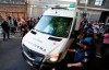 The press surrounds an ambulance believed to be transporting soccer legend Diego Maradona as it pulls away from Olivos Clinic in Buenos Aires, Argentina, Wednesday, Nov. 11, 2020. Maradona's manager and lawyer Matías Morla confirmed Wednesday that the world soccer legend would be discharged today from the hospital where he has been hospitalized for more than a week. (AP Photo/Natacha Pisarenko)