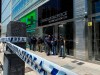 Police guard the entrance to Dr. Leopoldo Luque's practice in Buenos Aires, Argentina, Sunday, Nov. 29, 2020. Luque was Diego Maradona's personal doctor, and his house and offices were raided Sunday in the midst of investigations to establish the circumstances of Maradona's death. (AP Photo/Leo La Valle)