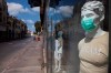 A face mask on a mannequin advertises them for sale, amid concerns over the country's coronavirus outbreak, on Israel's 72nd Independence Day, in Tel Aviv, Israel, Wednesday, April 29, 2020. Israel government announced a complete lockdown over the Independence Day to control the country's coronavirus outbreak. (AP Photo/Oded Balilty)